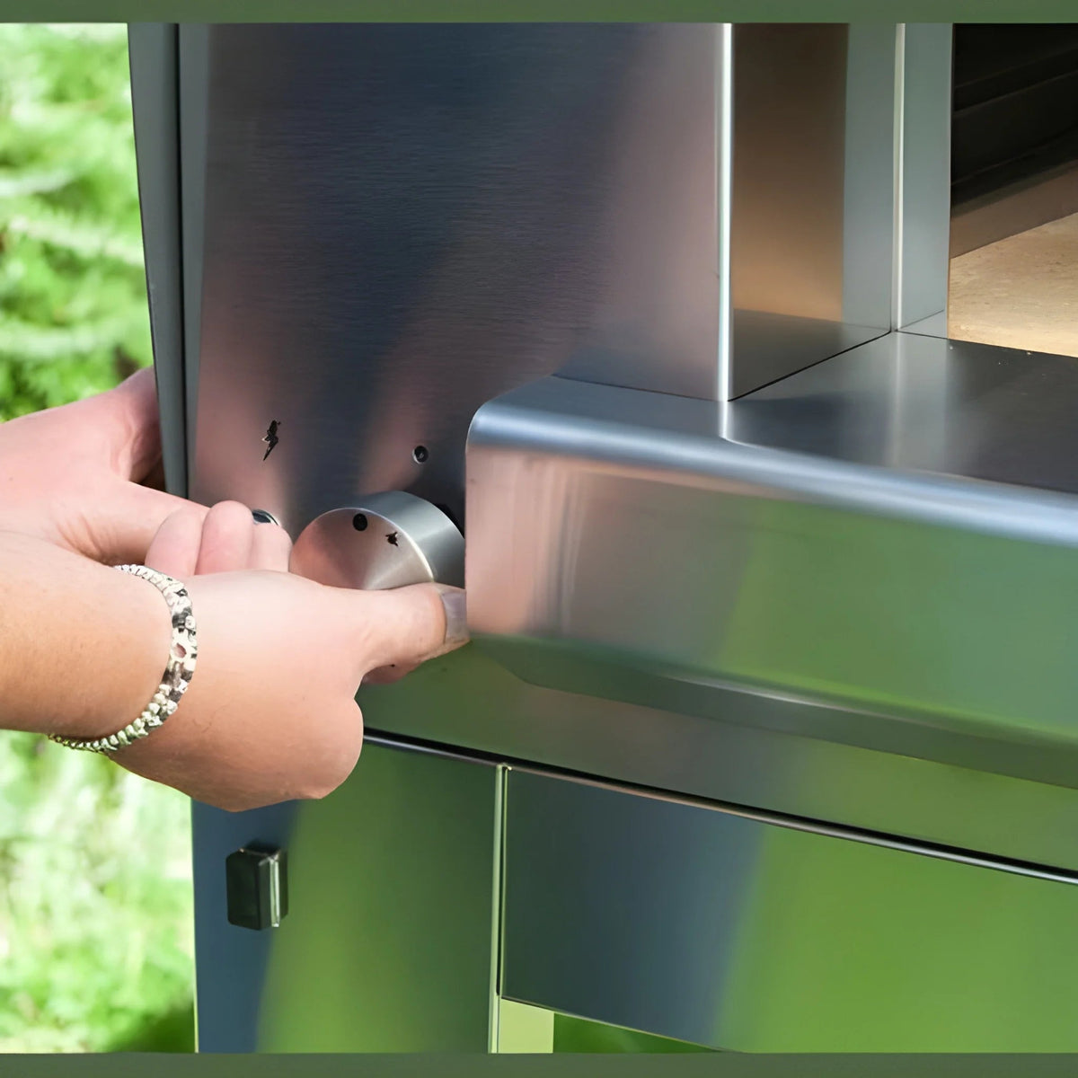 Stainless steel oven door handle with circular brushed metal knob on fontana margherita anthracite countertop dual fuel pizza oven