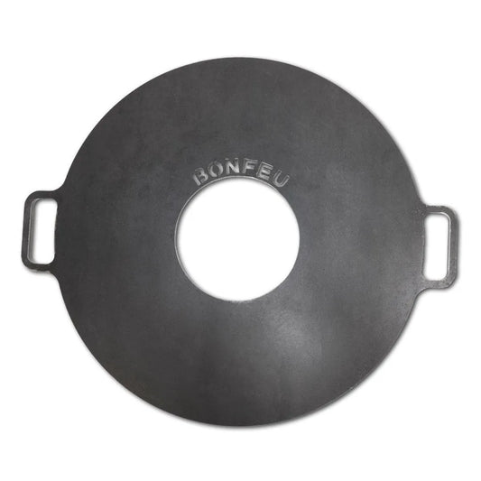 Black cast iron bonfeu plancha grill plate with central hole and side handles for bonfeu outdoor fireplaces