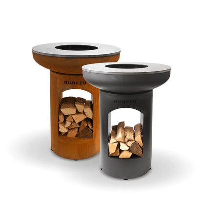Two bonfeu bonbiza open plancha grill fire pits in black and corten steel with circular wood burning tops outdoors