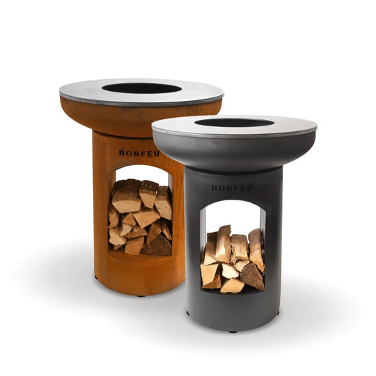 Two bonfeu bonbiza open plancha grill fire pits in black and corten steel with circular wood burning tops outdoors