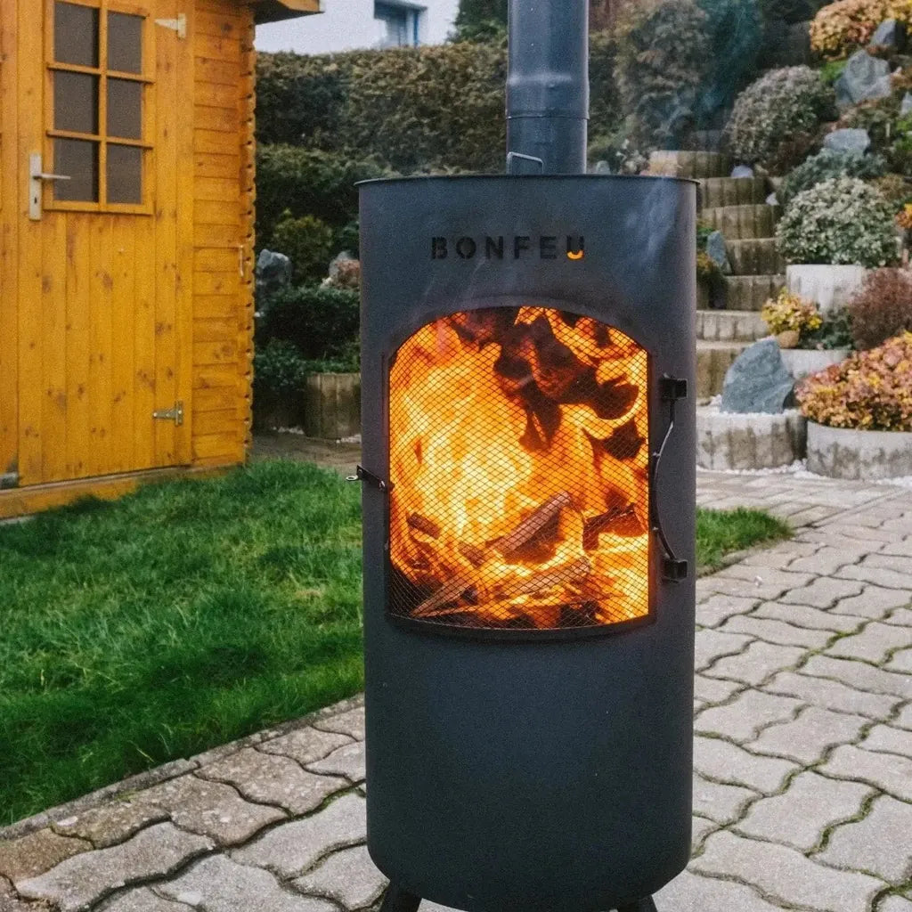 Black metal bonfeu bontino lp outdoor wood-burning stove with glowing fire inside and embossed brand name on front