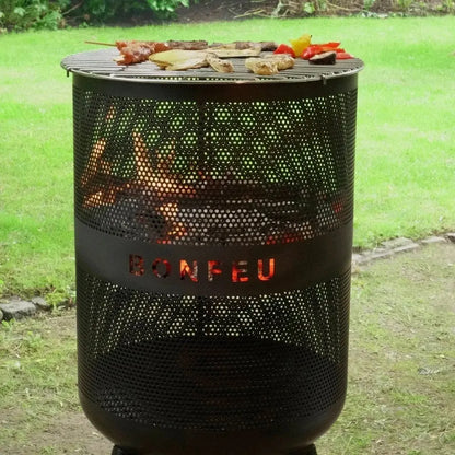 Black perforated metal grill with bonfeu branding and glowing embers inside bonfeu bonves 45 fire pit fire basket