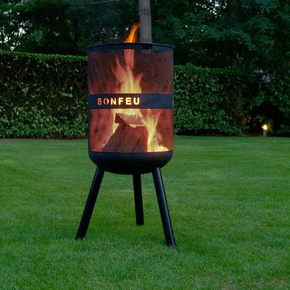 Black perforated metal bonfeu bonves 45 fire pit standing on three legs outdoors for outdoor use