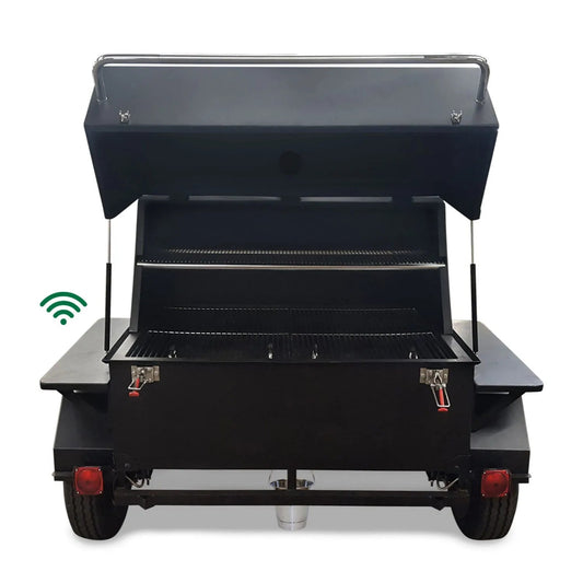 Black portable charcoal grill on trailer with stainless steel handles and red latches gmg big pig trailer rig smoker