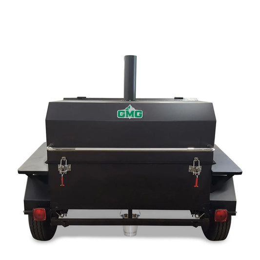 Black gmc brand pellet smoker grill with wifi mounted on trailer showing back with red taillights and silver handlebars