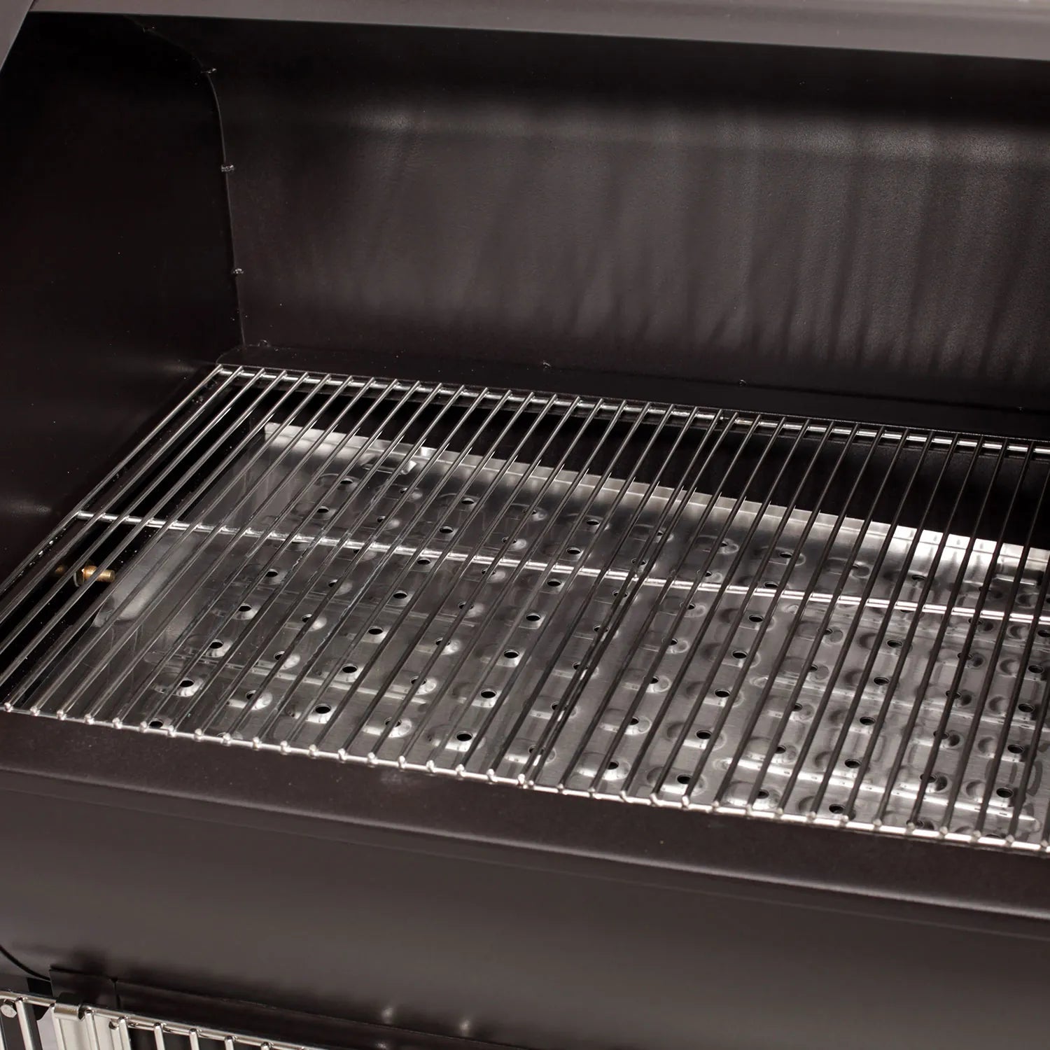 The GMG Daniel Boone Choice WiFi pellet grill smoker is a black rectangular grill with a metal grate inside