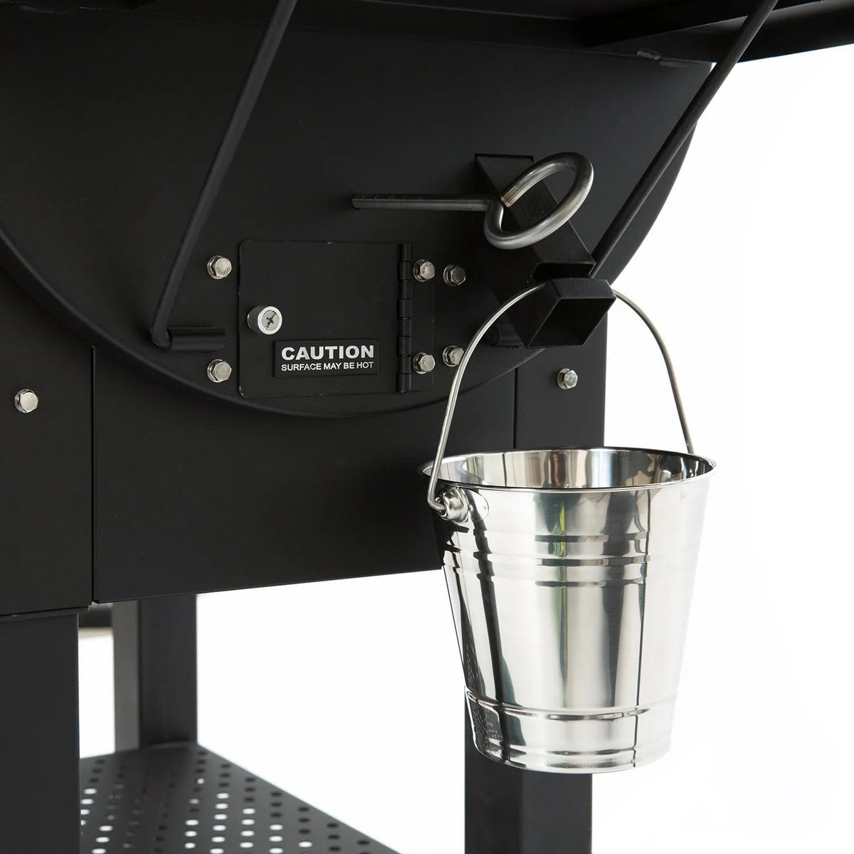 A shiny metallic silver bucket with handle hangs on the black GMG ledge prime plus wifi pellet grill smoker