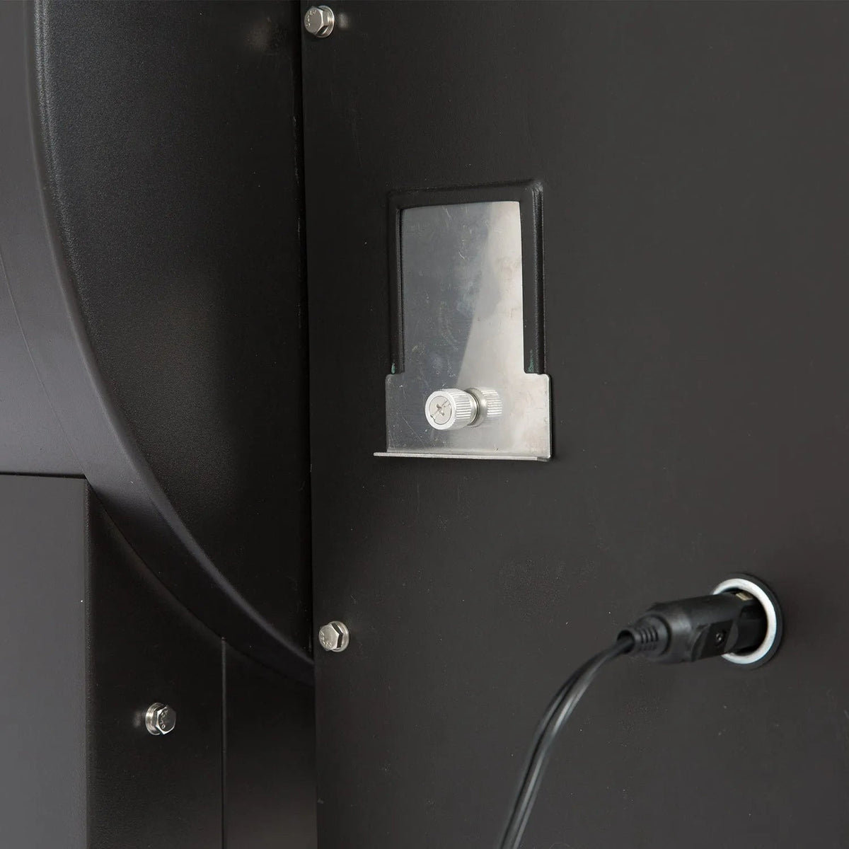 Back side of black gmg ledge prime plus wifi pellet grill smoker showing industrial power outlet with silver plate and knob