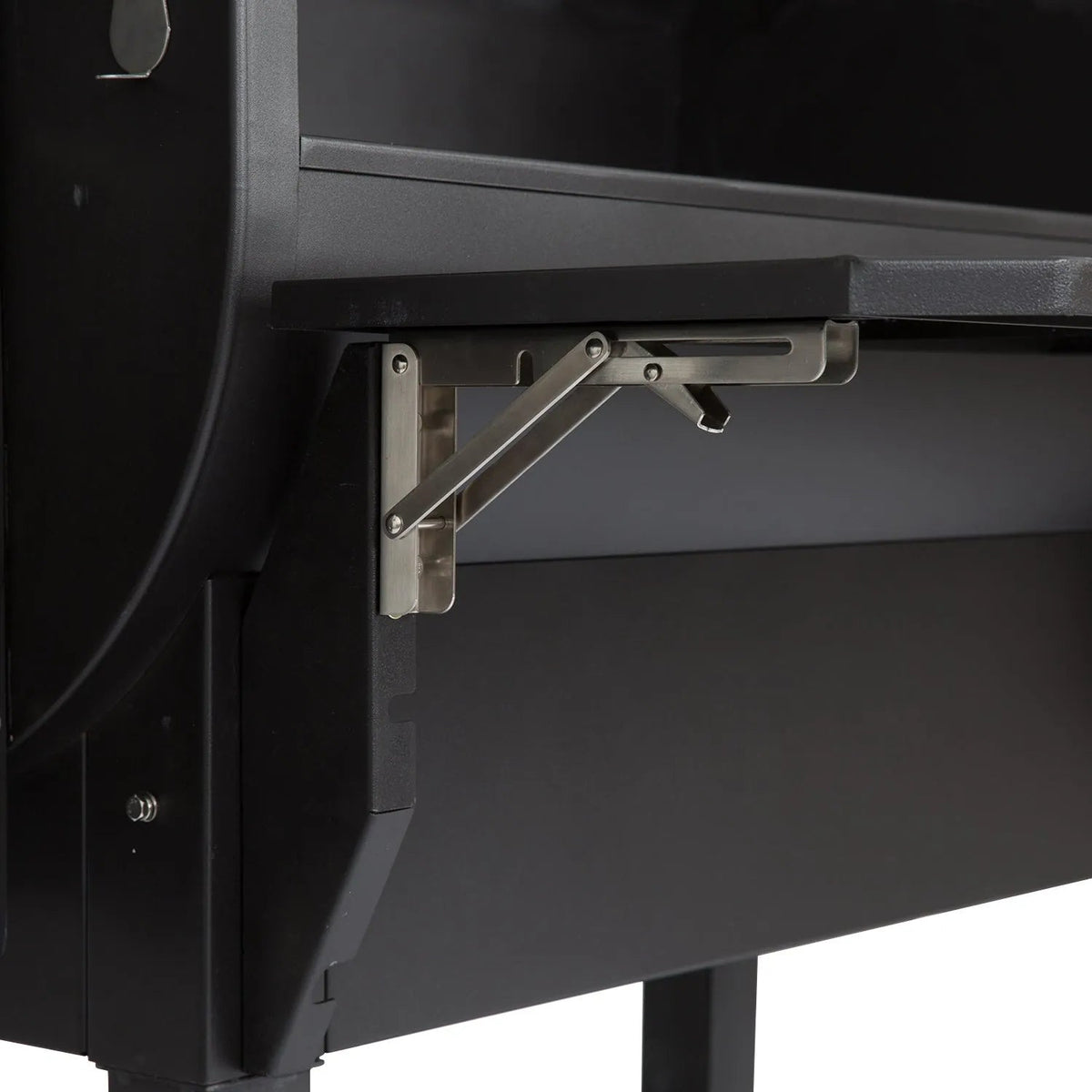 Stainless steel foldable shelf bracket attached to black gmg ledge prime plus wifi pellet grill smoker