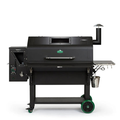 Black GMG Peak Prime Plus WiFi pellet grill smoker with green wheels and stainless steel bucket for outdoor cooking