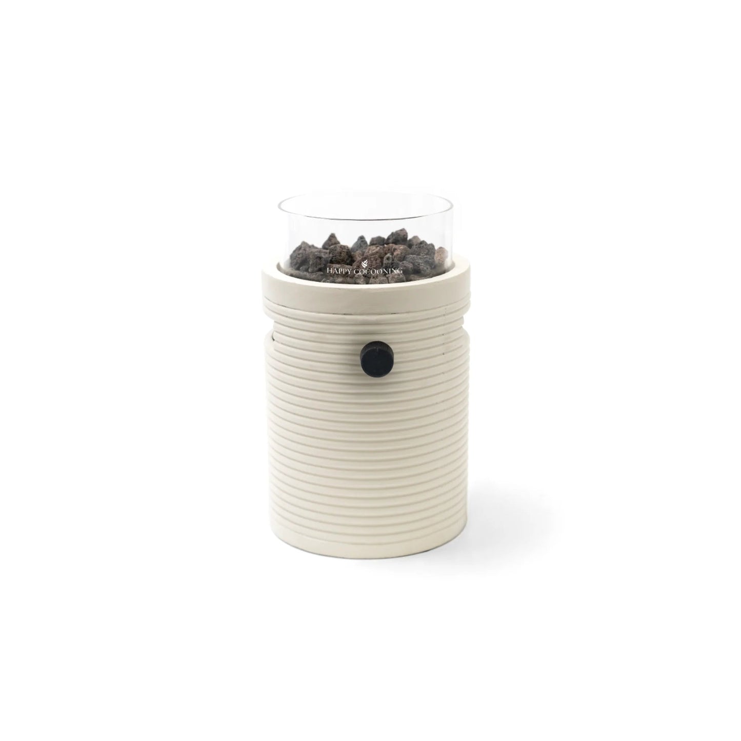 Cream-colored ceramic Happy Cocooning Lumi Groove tabletop gas fireplace with vertical ridges and glass top holding dark stones