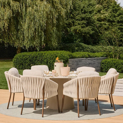 Beige woven outdoor dining set with wooden legs and matching round table paired with happy cocooning lumi rib tabletop gas fireplace
