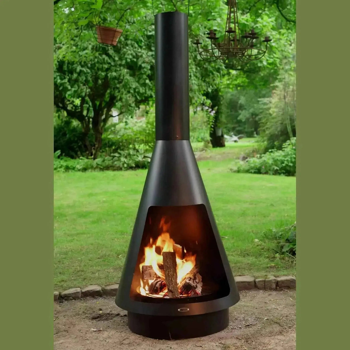 Black metal conical outdoor fireplace with tall chimney and burning logs inside from HEAT La Luz CH.002 collection