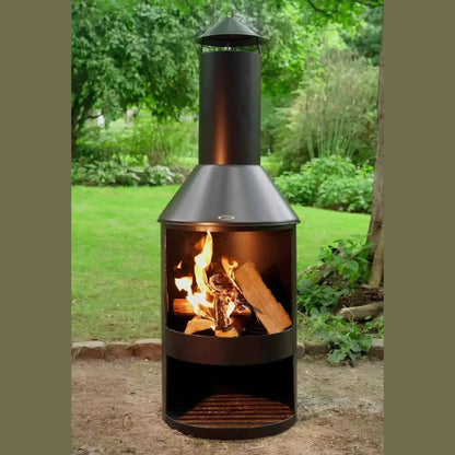Black metal heat larvik outdoor fireplace with conical chimney and burning logs inside for garden use