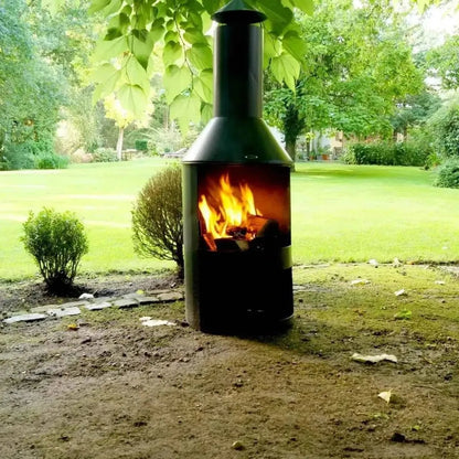 Black metal HEAT Larvik outdoor fireplace with a tall chimney and visible flames inside for outdoor heating