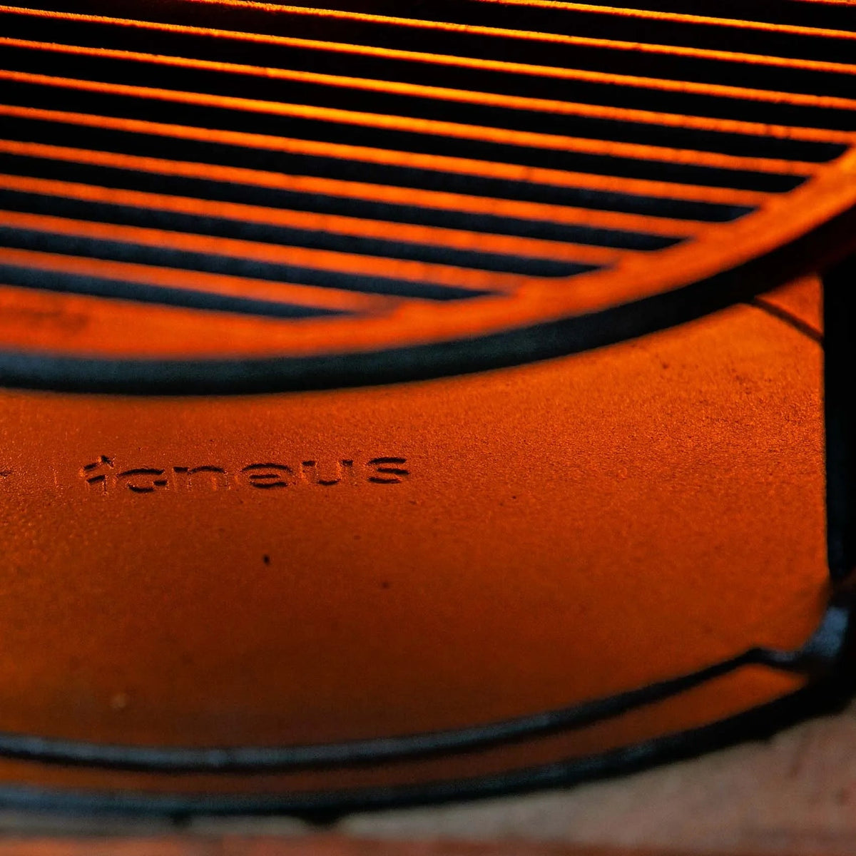 Orange cast iron grill grate with tonaus engraving for igneus cast iron tuscan grill pizza oven cooking grate