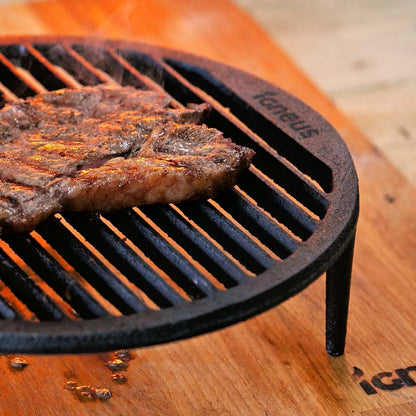 Black cast iron igneus tuscan grill with vertical slats and taneus engraving for pizza oven cooking grate