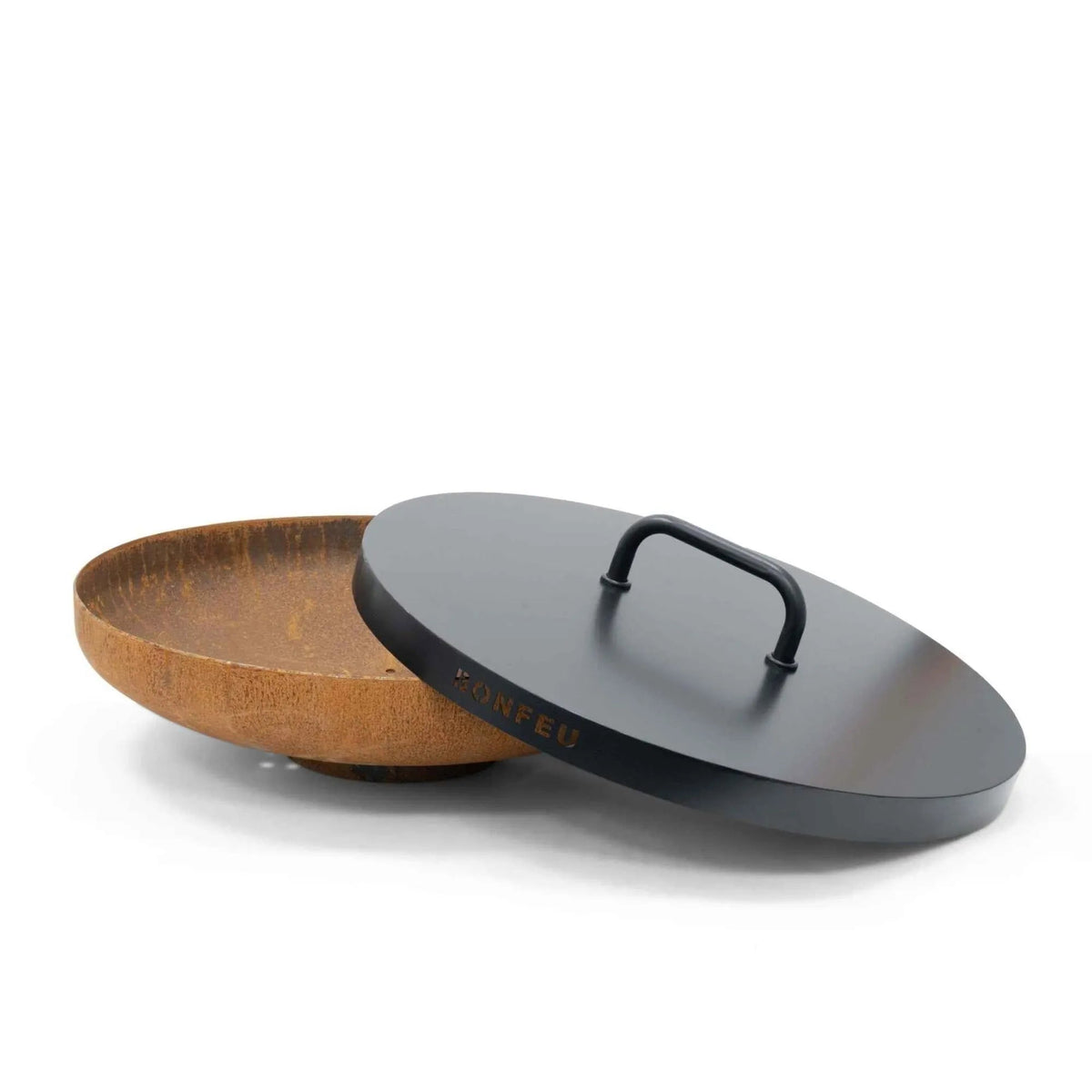 Black steel lid with handle resting on rusted steel fire pit bowl for BonFeu BonBowl and BonBowl Plus