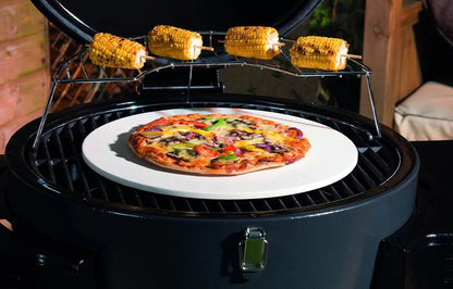 Lifestyle dragon egg charcoal bbq lfs300 with white ceramic pizza stone and freshly baked vegetable pizza on top