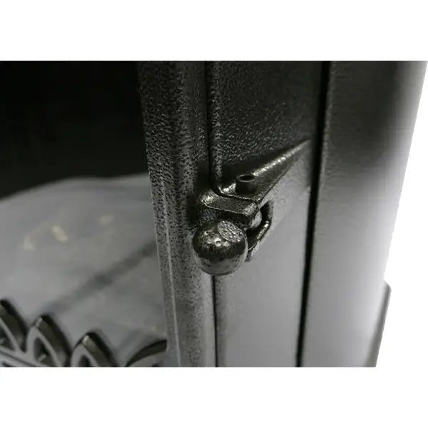 Black cast iron latch with textured surface and rounded knob on lifestyle serenta real flame cabinet heater 3.4 kw