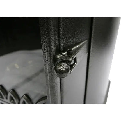 Black cast iron latch with textured surface and rounded knob on lifestyle serenta real flame cabinet heater 3.4 kw