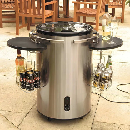 Lifestyle stainless steel electric party cooler in silver with black lid side tables and wire baskets for cans and bottles
