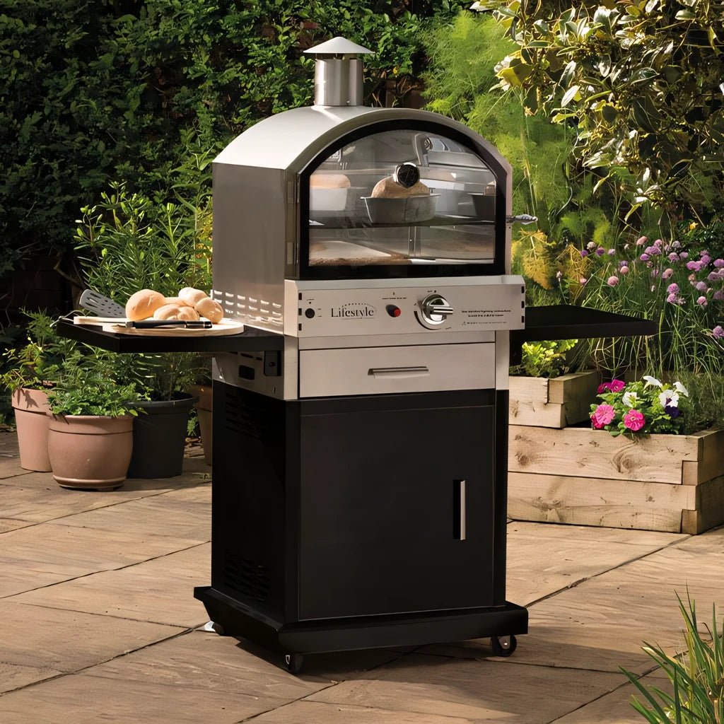 Lifestyle Verona Alfresco gas pizza oven in stainless steel and black with glass door side trays and storage cabinet on wheels