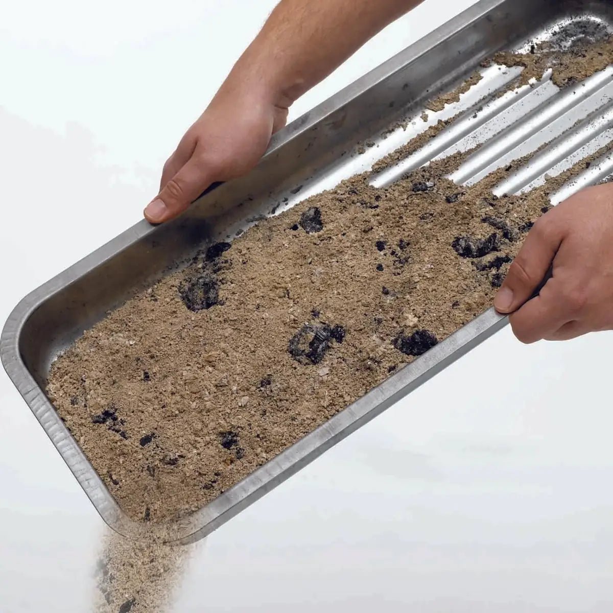 Rectangular metal Martinsen charcoal tray filled with brown sand and dark charcoal fragments for 50 cm box BBQs