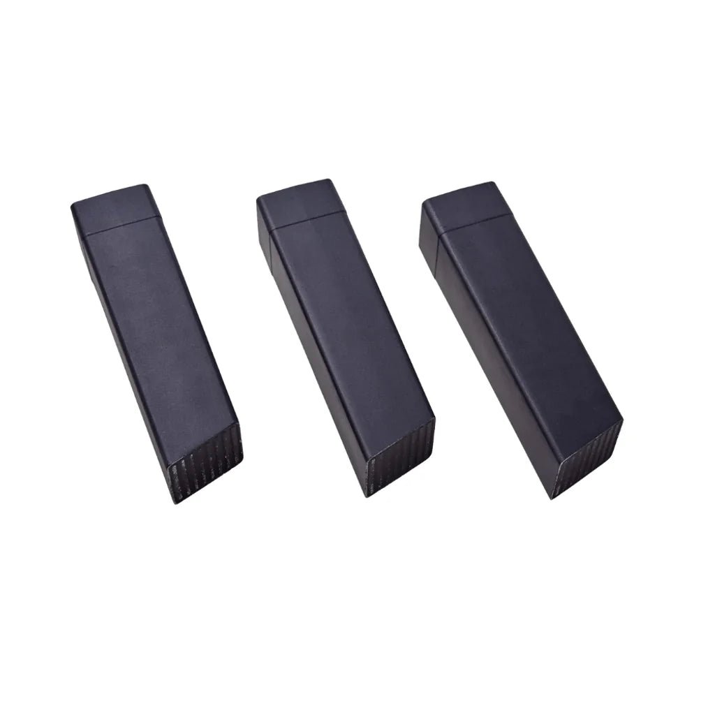 Three sleek black aluminum usb flash drives with matte finish and textured edges for moddern kamado pedestal legs