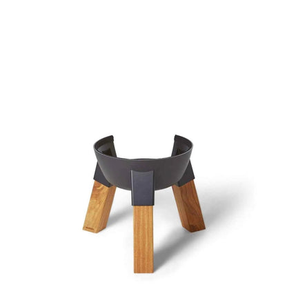 Black metal fire pit with natural wood modern kamado pedestal legs for sturdy outdoor cooking support