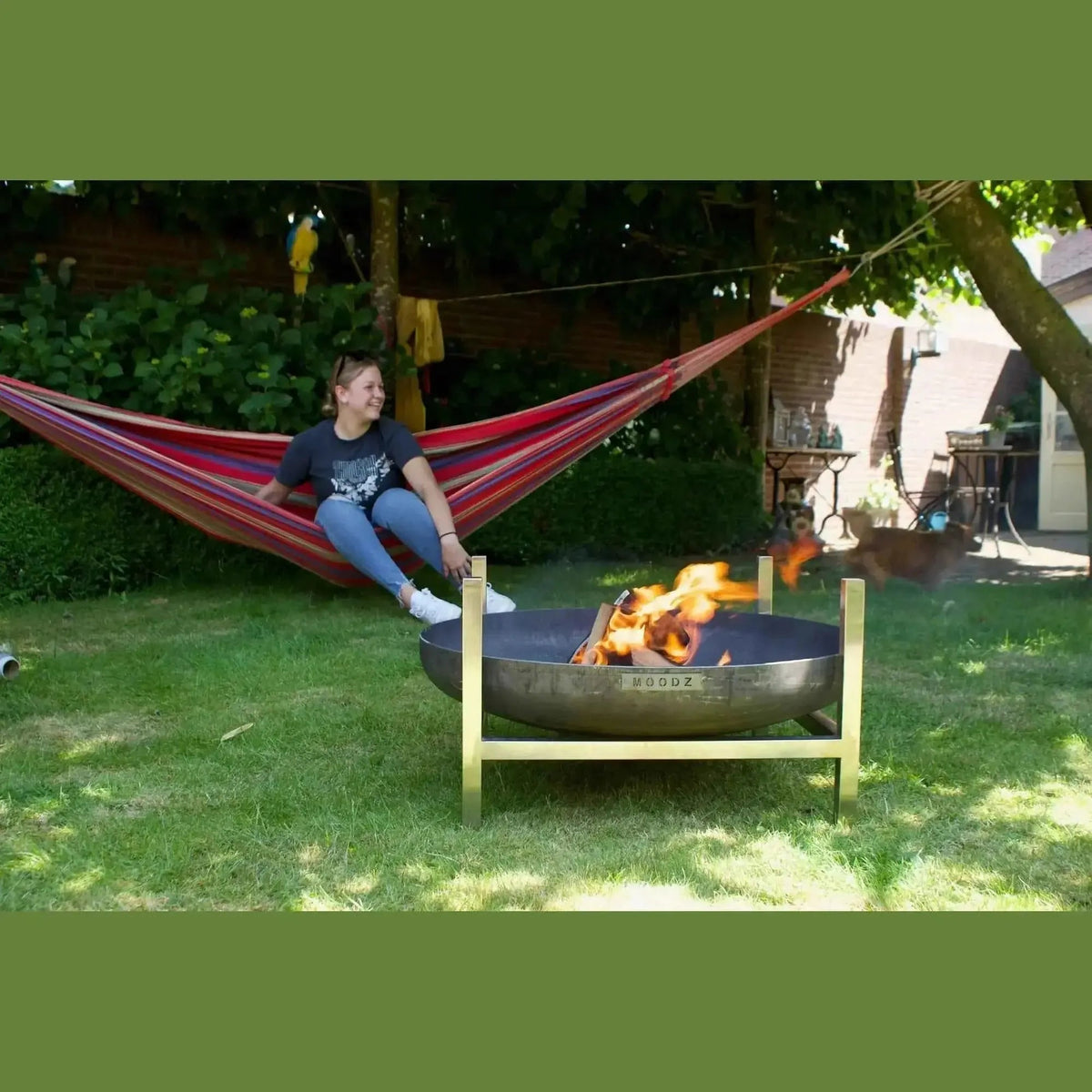 Bronze metal fire pit with gold frame and woodz engraving in moodz frame for garden fire bowls square design