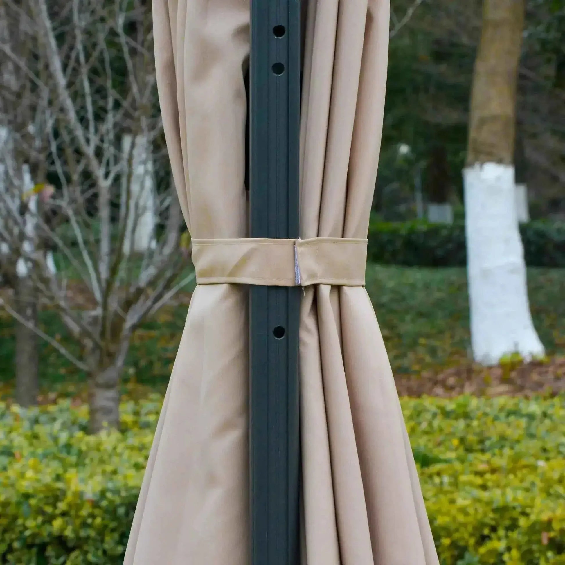 Beige fabric curtain tied with matching belt around dark gray metal pole of outsunny 3m solar led cantilever parasol base