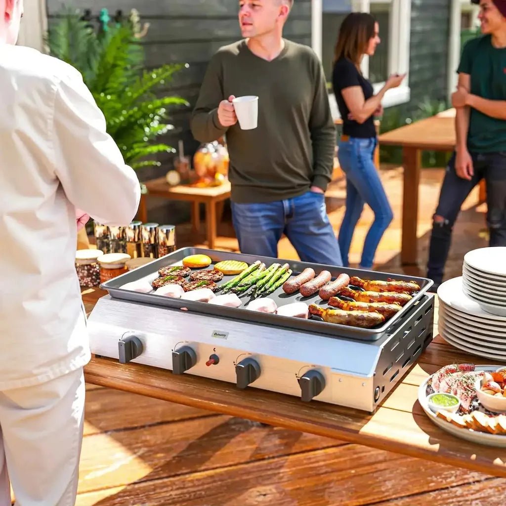 Outsunny 4-burner portable stainless steel gas grill with black control knobs and a flat griddle surface