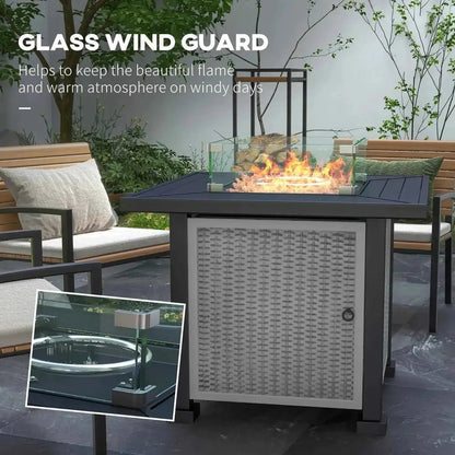 Black metal outdoors fire pit table with glass wind guard and woven gray side panel by Outsunny