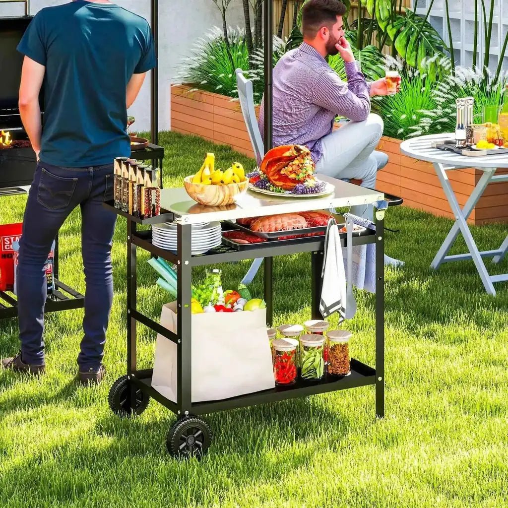 Black metal outdoor bbq trolley with stainless steel white countertop and adjustable shelves stocked with food items