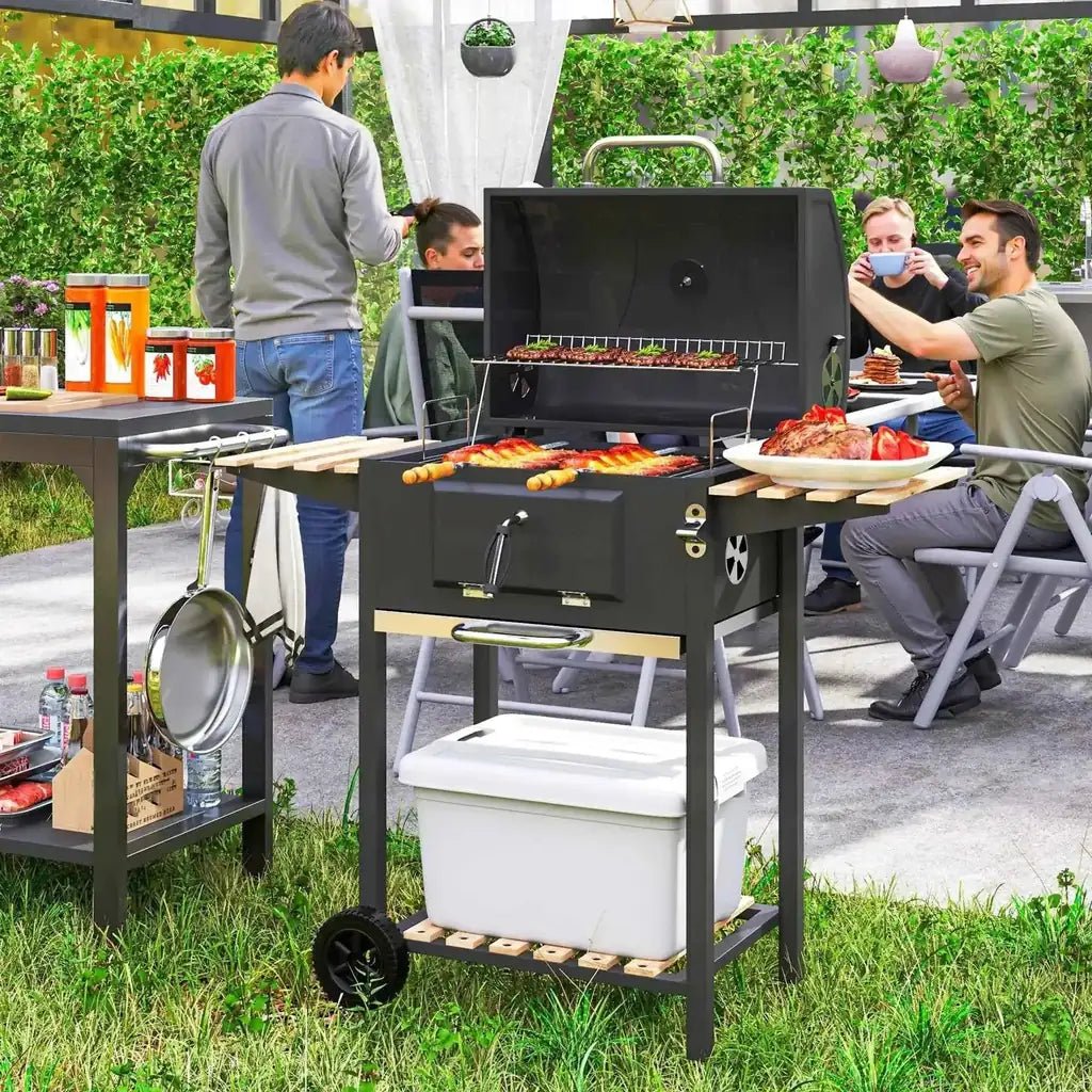 Black Outsunny charcoal BBQ grill with adjustable pan, stainless steel handles, shelves, wheels, and white cooler underneath