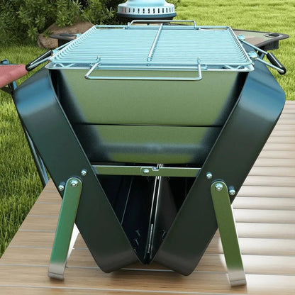 Black foldable charcoal grill with silver metal legs and wire rack by Outsunny for portable BBQ grilling
