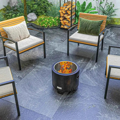 Black cylindrical metal wood-burning smokeless fire pit with burning flame outdoors by Outsunny 42cm