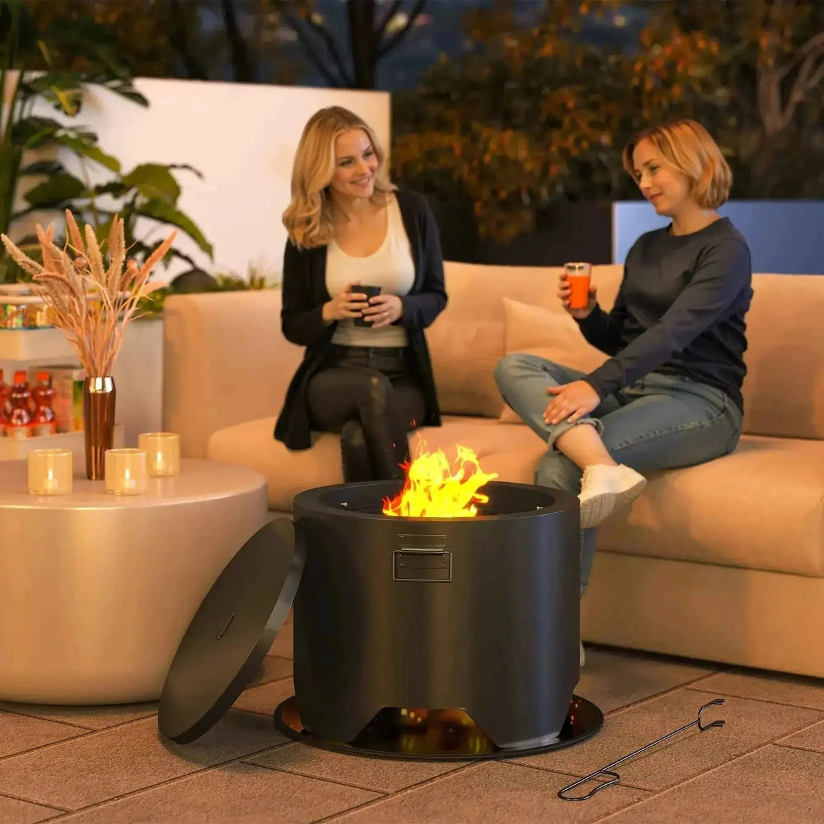 Outsunny outdoor round black cylindrical fire pit with lid and fire poker showing flame inside for patio use