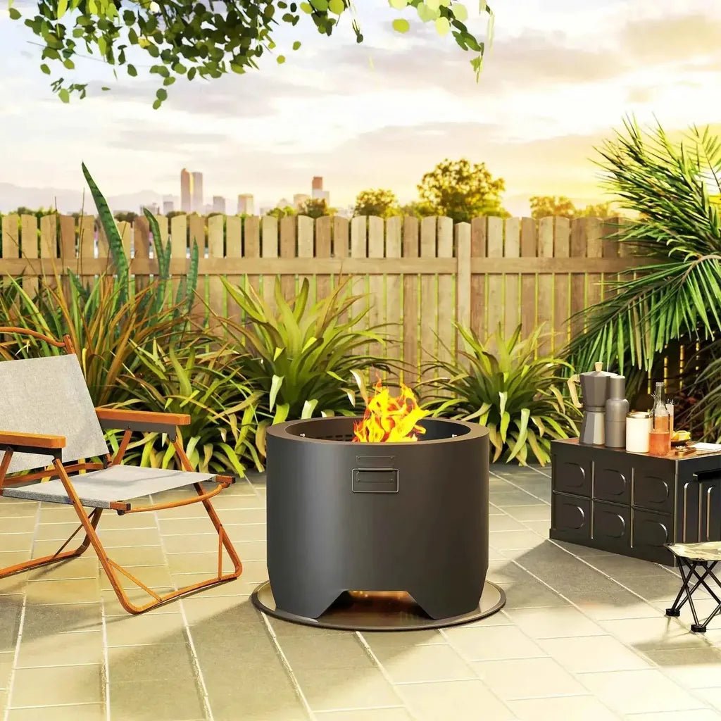 Outsunny outdoor round black cylindrical metal fire pit with flame burning inside and small side handle