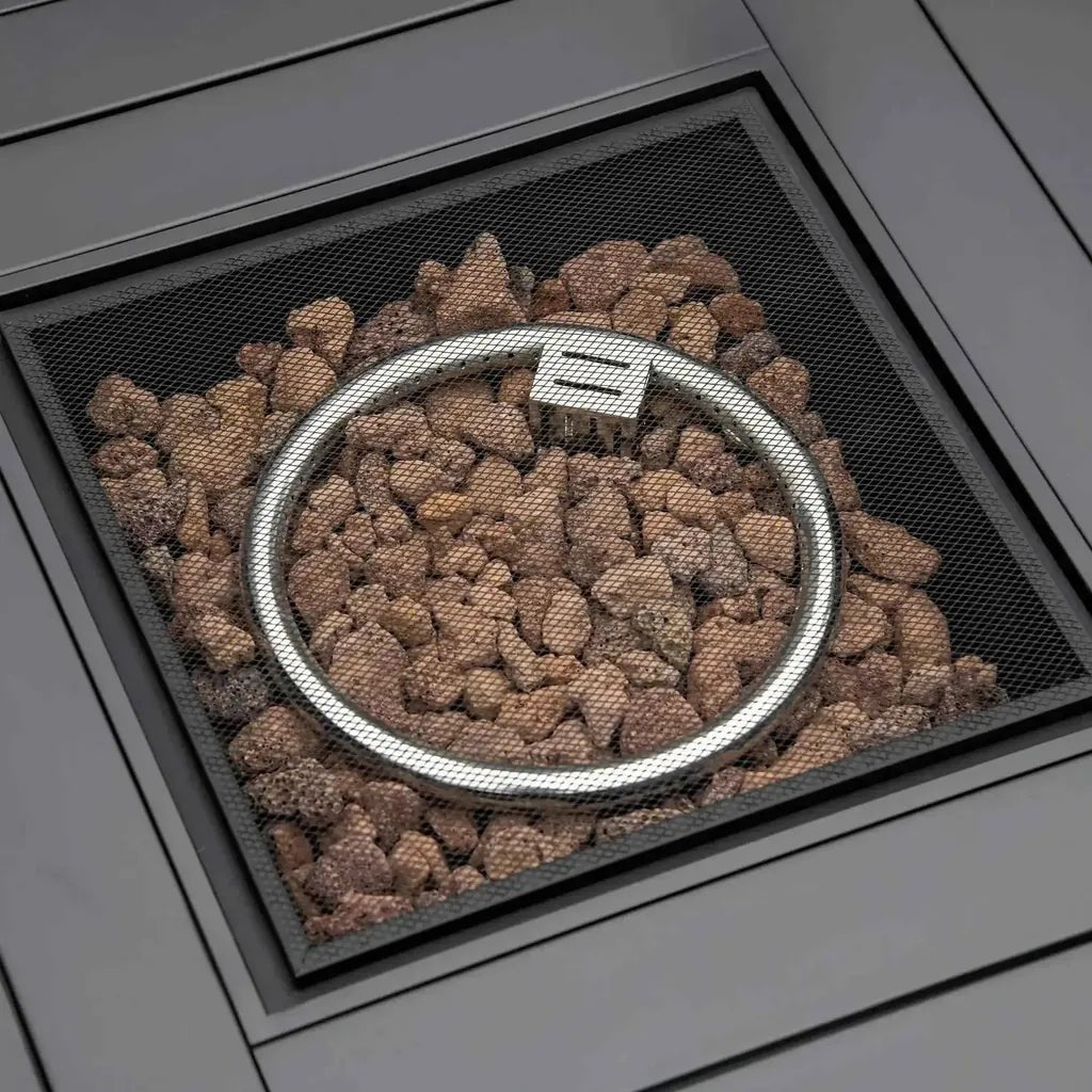 Silver circular fire pit burner with mesh grate and brown lava rocks in outsunny mixed grey rattan gas fire pit table