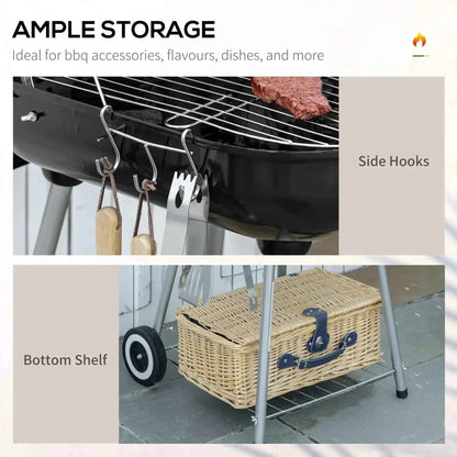 Outsunny portable black charcoal grill with wheels side hooks and bottom shelf holding wicker picnic basket
