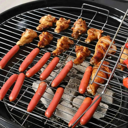 Grilled chicken wings and sausages sizzling on a black Outsunny portable charcoal kettle grill with trolley and metal grates