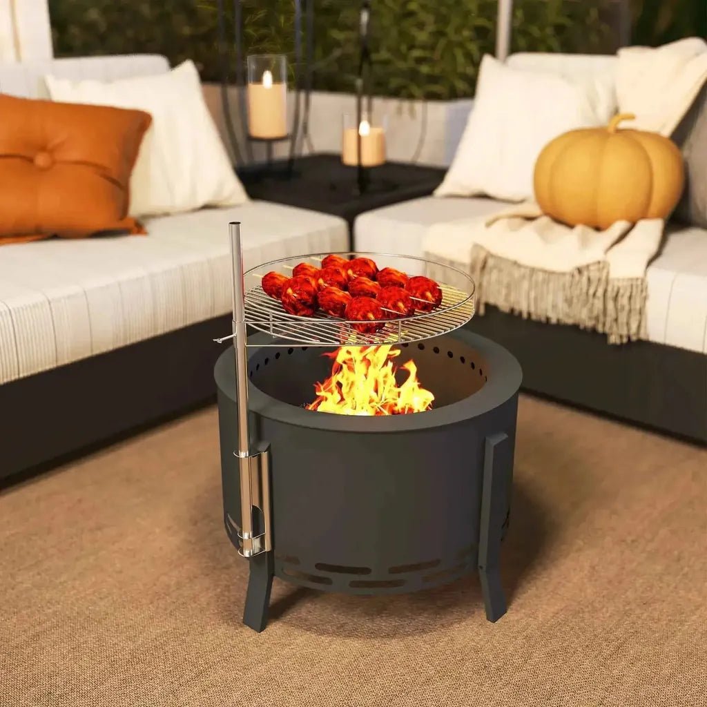 Outsunny black metal portable fire pit 58cm round with grill grate roasting meat above flames and ash catcher