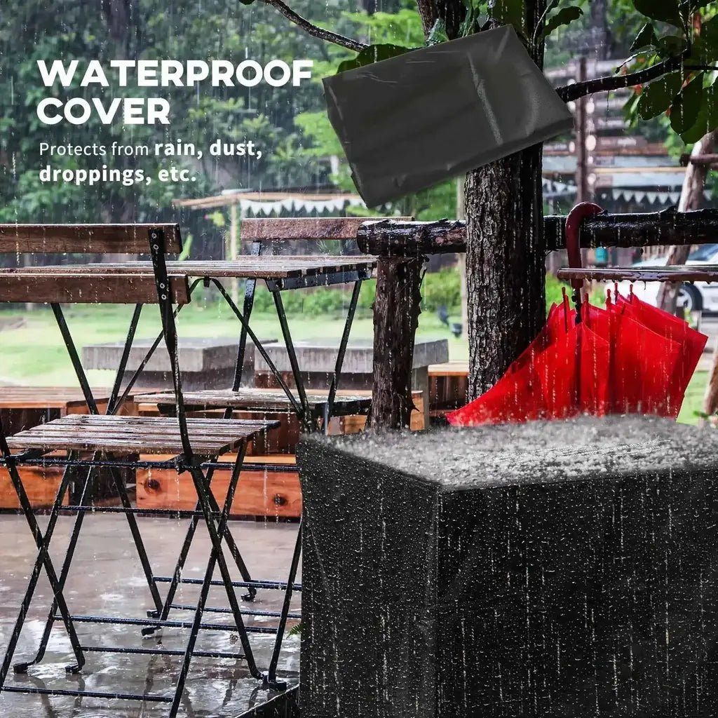 Black waterproof cover draped over tree trunk protecting outsunny grey rattan propane gas fire pit table 40000 btu