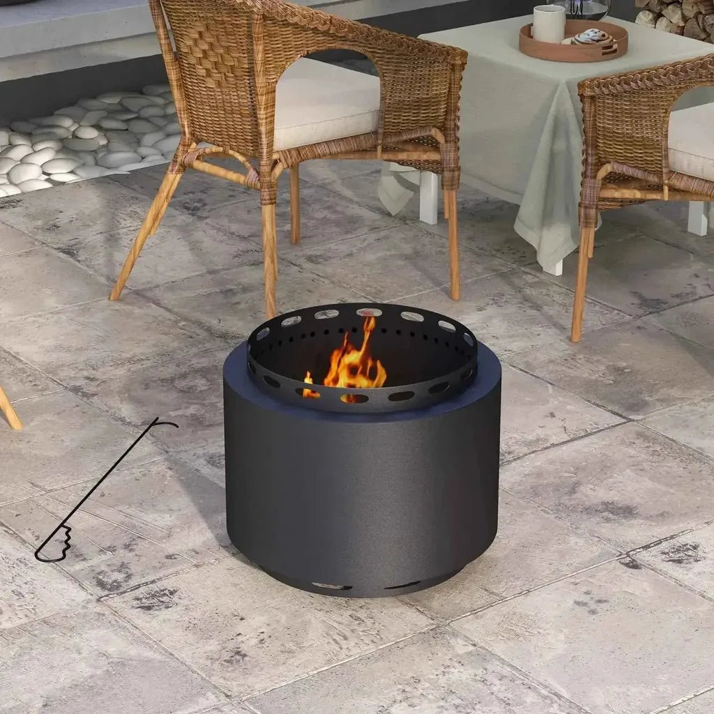 Black outsunny smokeless portable fire pit with perforated metal rim and flames burning inside with poker
