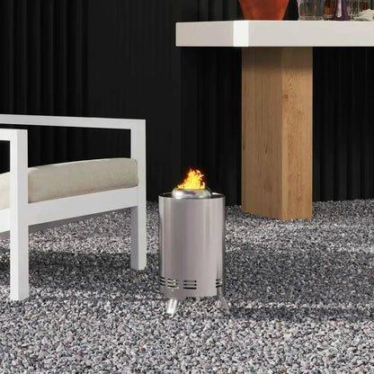 Outsunny smokeless stainless steel cylindrical outdoor fire pit with flame burning inside and three legs in silver tone