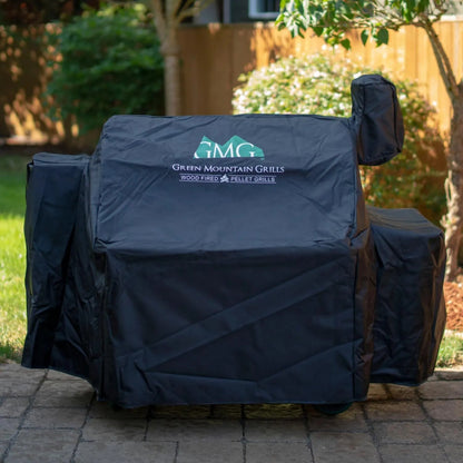 Black fabric protective cover for GMG pellet grills with embroidered green and white green mountain grills logo