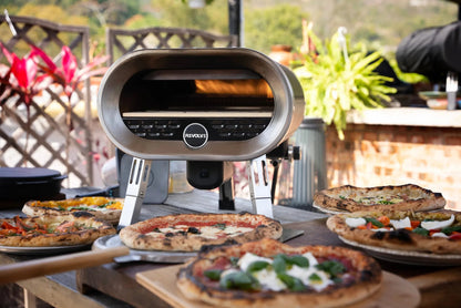 Stainless steel revolve pizza oven with sleek oval design and digital control panel for gas-fired rotating stone use