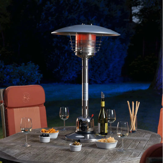 Silver sirocco tabletop patio heater lfs805 with red glowing heating element and protective metal cage